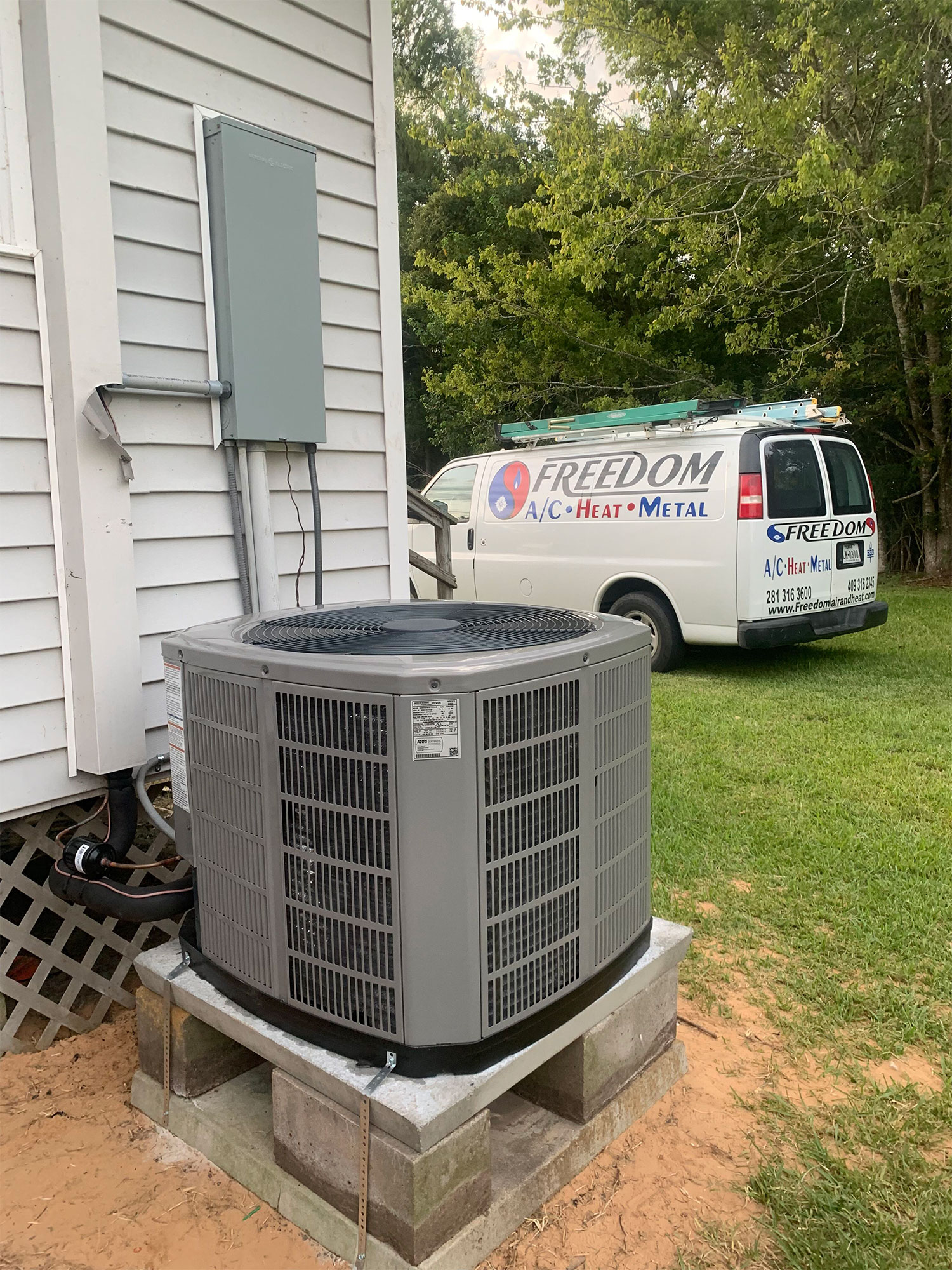 Freedom Air Conditioning and Heating van at a customers home